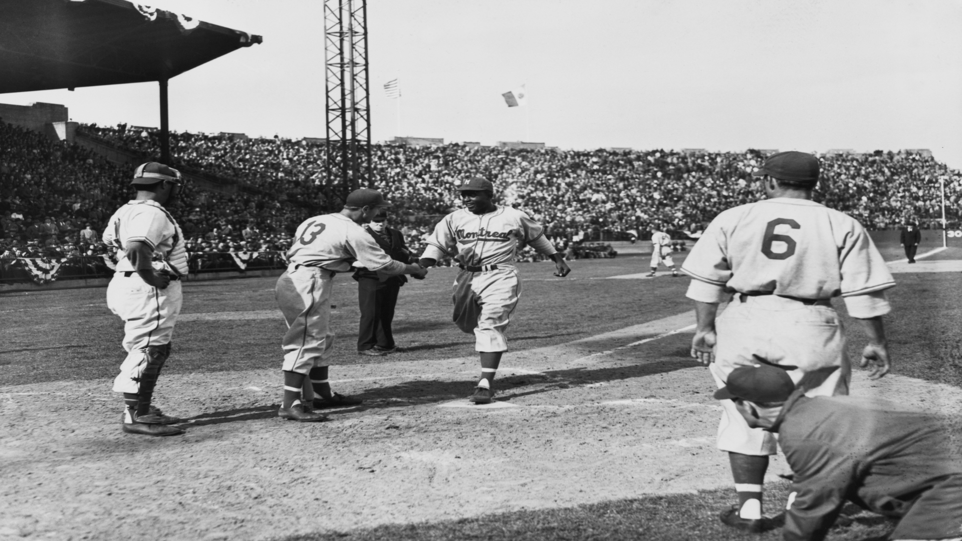 A handshake from a white teammate signaled Jackie Robinson's arrival in  America's game