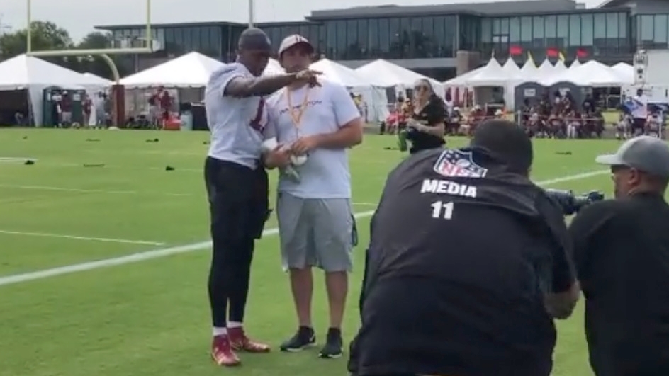 WFT's Terry McLaurin gifts a pair of cleats to a young fan