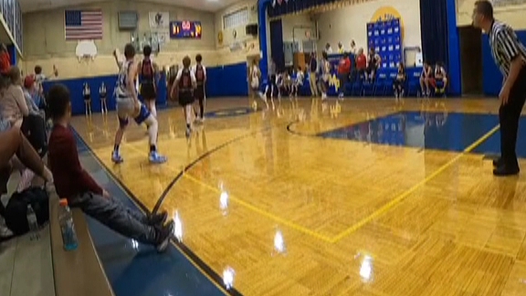 Middle schooler wins team basketball game with incredible 'full-court buzzer -beater