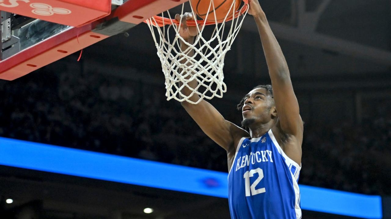 Video: Louisville player throws water bottle at Kentucky fans after game 