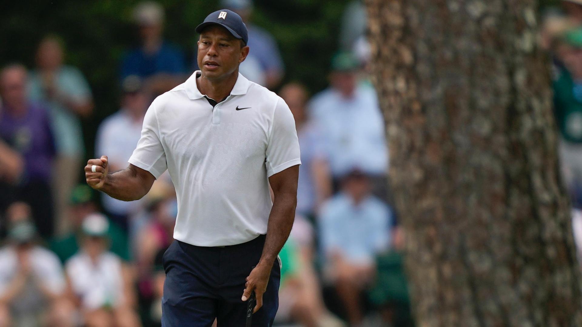 Tiger gives fist bump after long birdie putt
