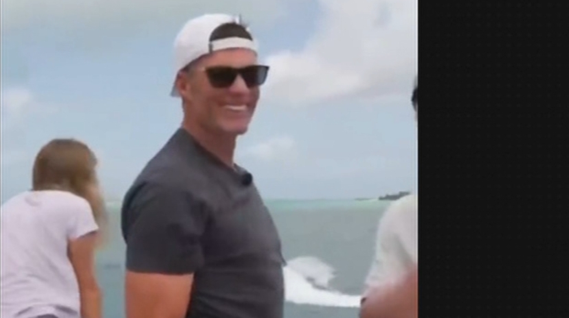 Tom Brady nails a drone with a football off a yacht