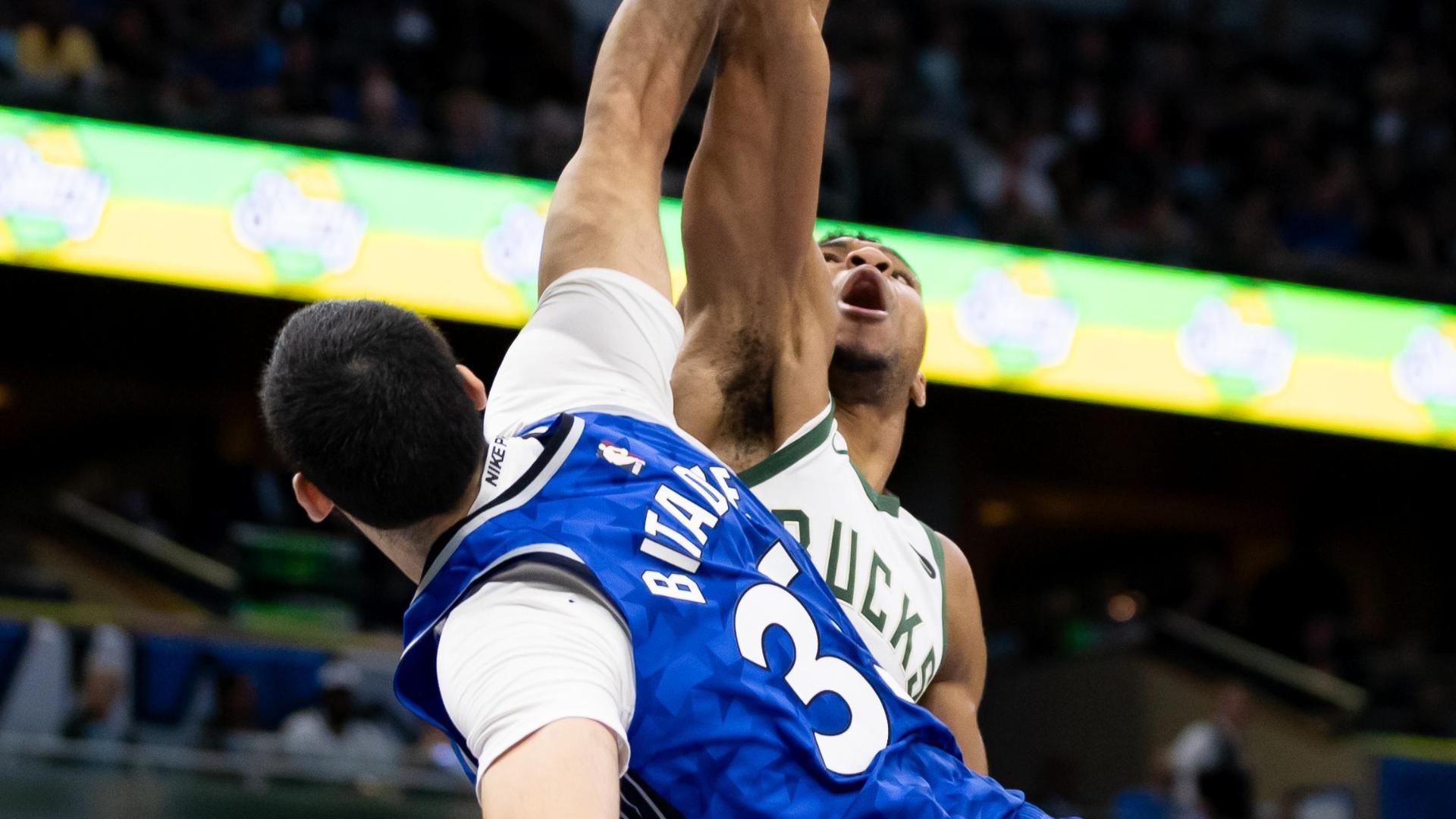 Giannis spins and slams from the free throw line Stream the Video