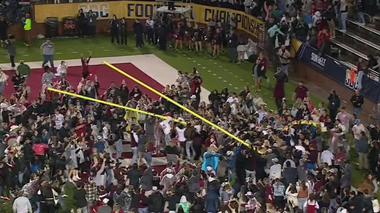 Troy fans bring down the goalpost after win vs. App State