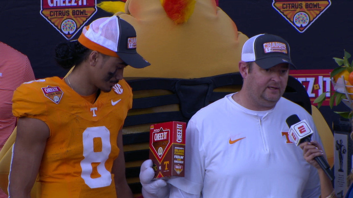 'ChedZ' slides box of CheezIt crackers through Josh Heupel's postgame