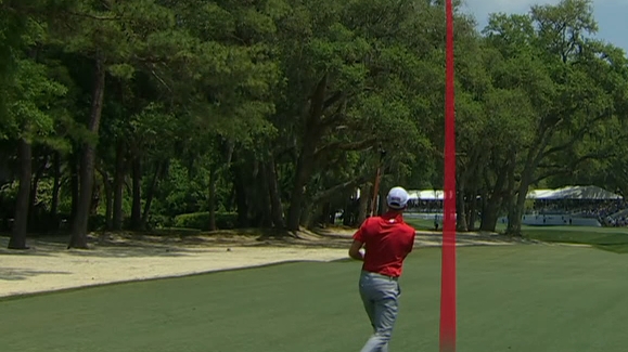 Webb Simpson lofts one over the trees for an eagle