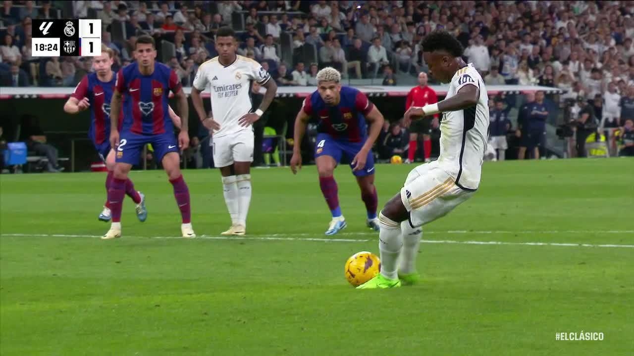 Vinicius Jr. slots home the penalty to level the score for Real Madrid