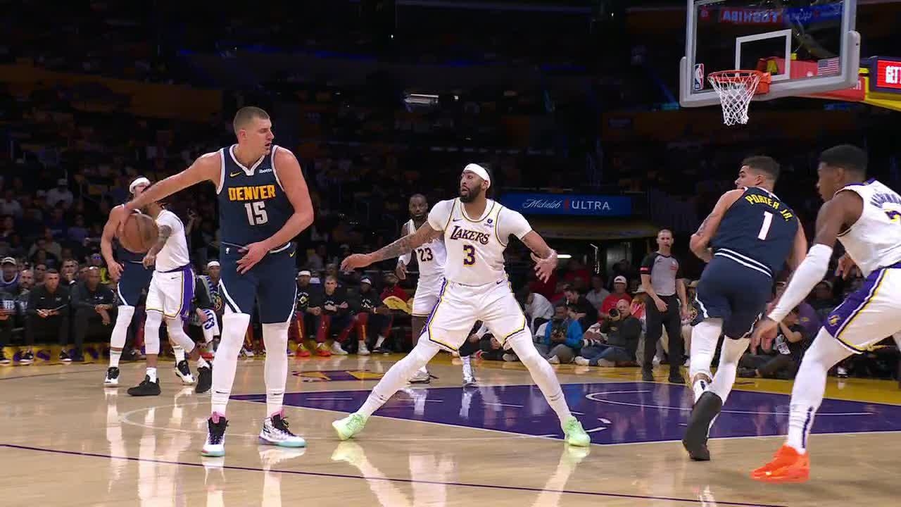 Nikola Jokic shows off with a behind-the-back dime