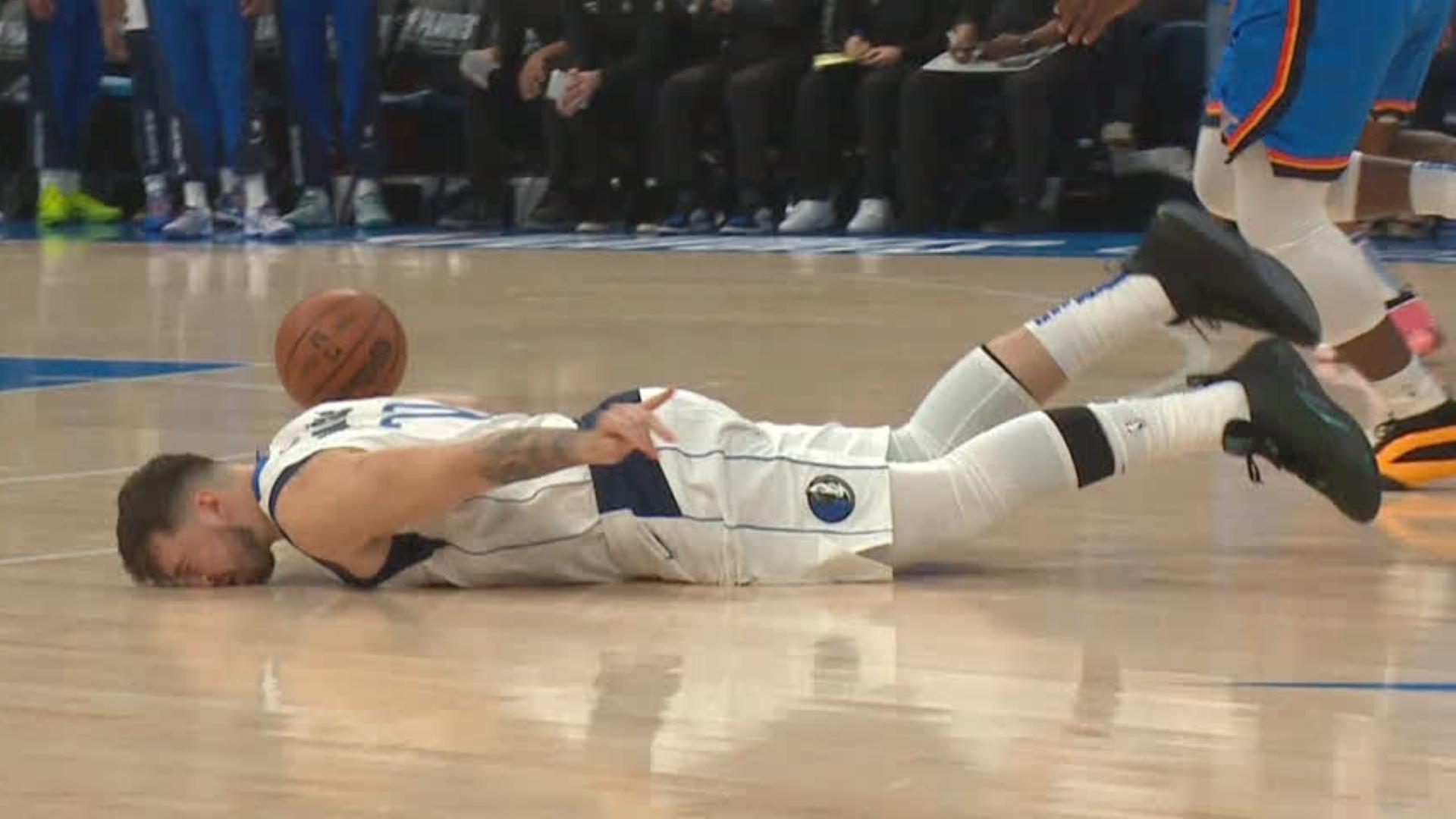 Luka faceplants after getting tangled up with Lu Dort