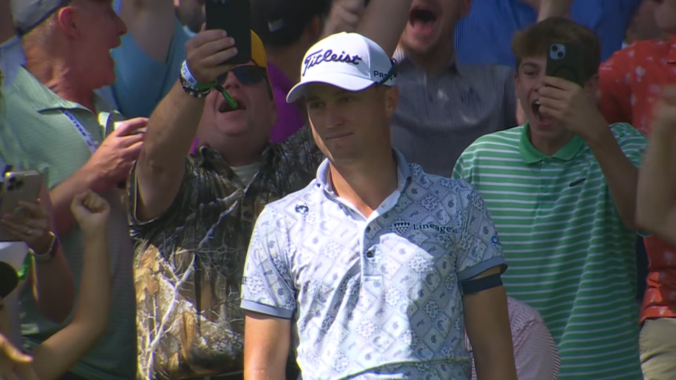 Justin Thomas chips in from the crowd fringe