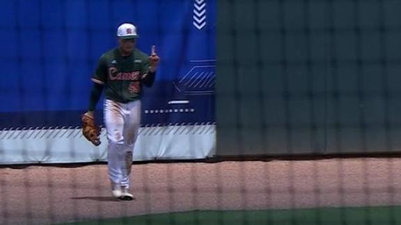 Miami left fielder wags his finger after game-sealing catch