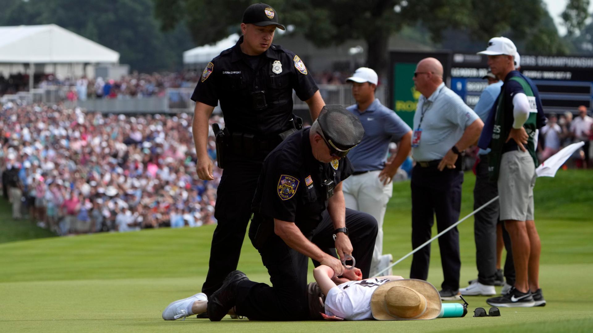 Protesters arrested after invading 18th green at Travelers