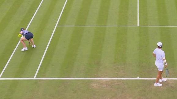 Wimbledon match disrupted by champagne cork on court
