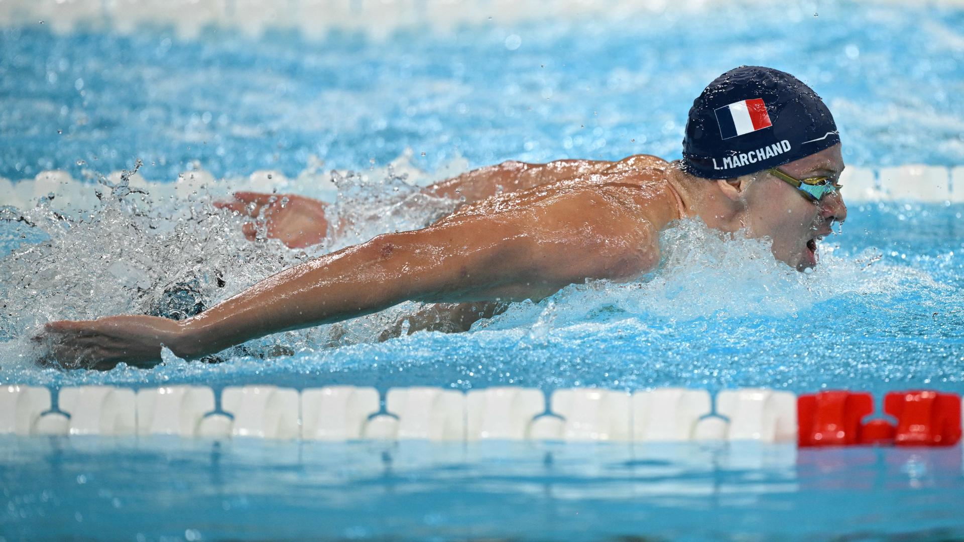 Leon Marchand sets Olympic record, wins 200m butterfly gold