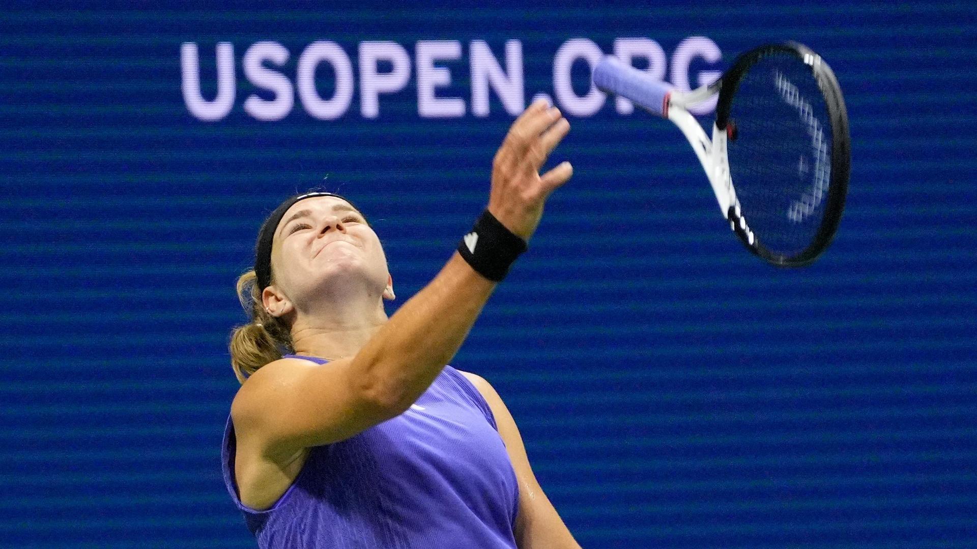 Muchova tosses racket in air after return hits net