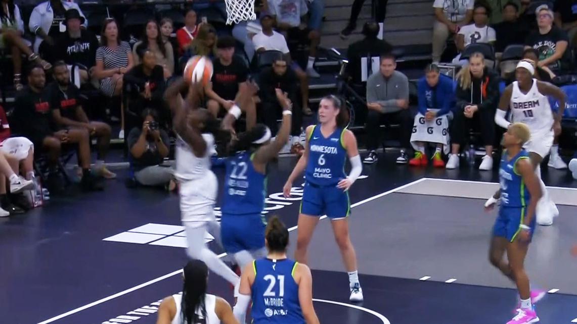 Tina Charles somehow flips in and-1 over her head