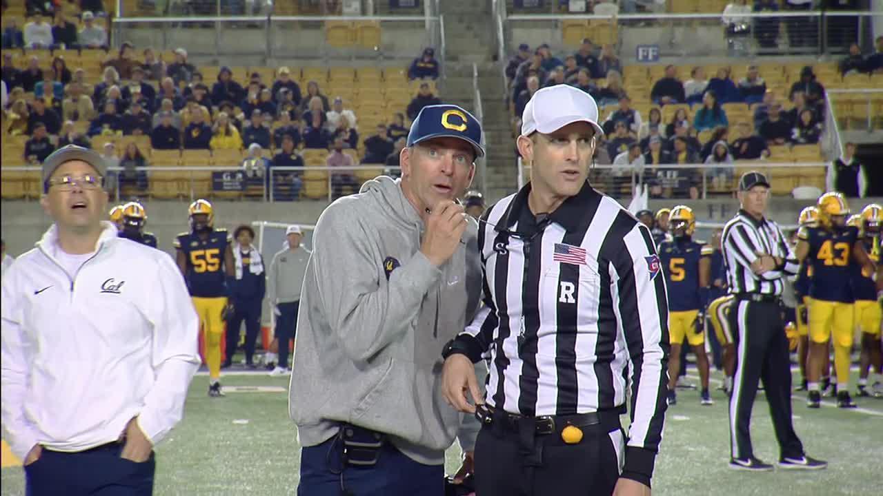 Cal coach takes ref's mic to admonish fans for penalty