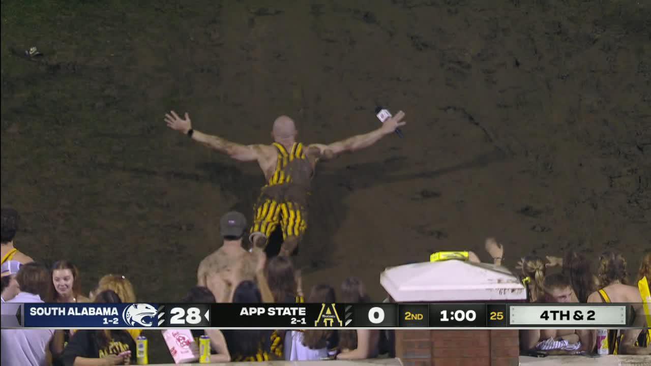 ESPN reporter Harry Lyles Jr. mudslides at Appalachian State game