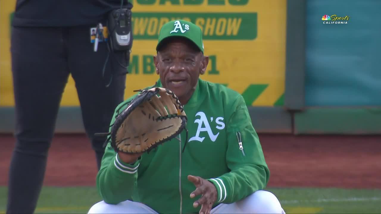 Rickey Henderson catches ceremonial first pitch from his daughter