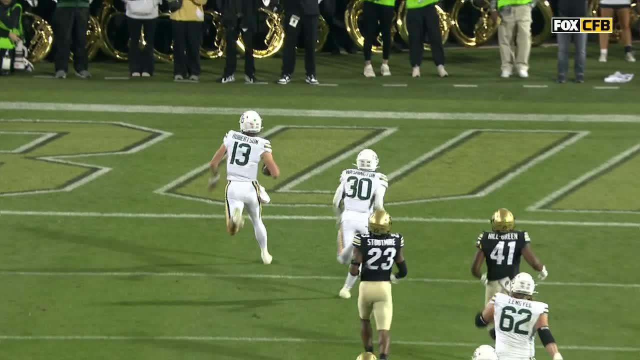 Sawyer Robertson stiff-arms a defender en route to a 45-yard Baylor TD