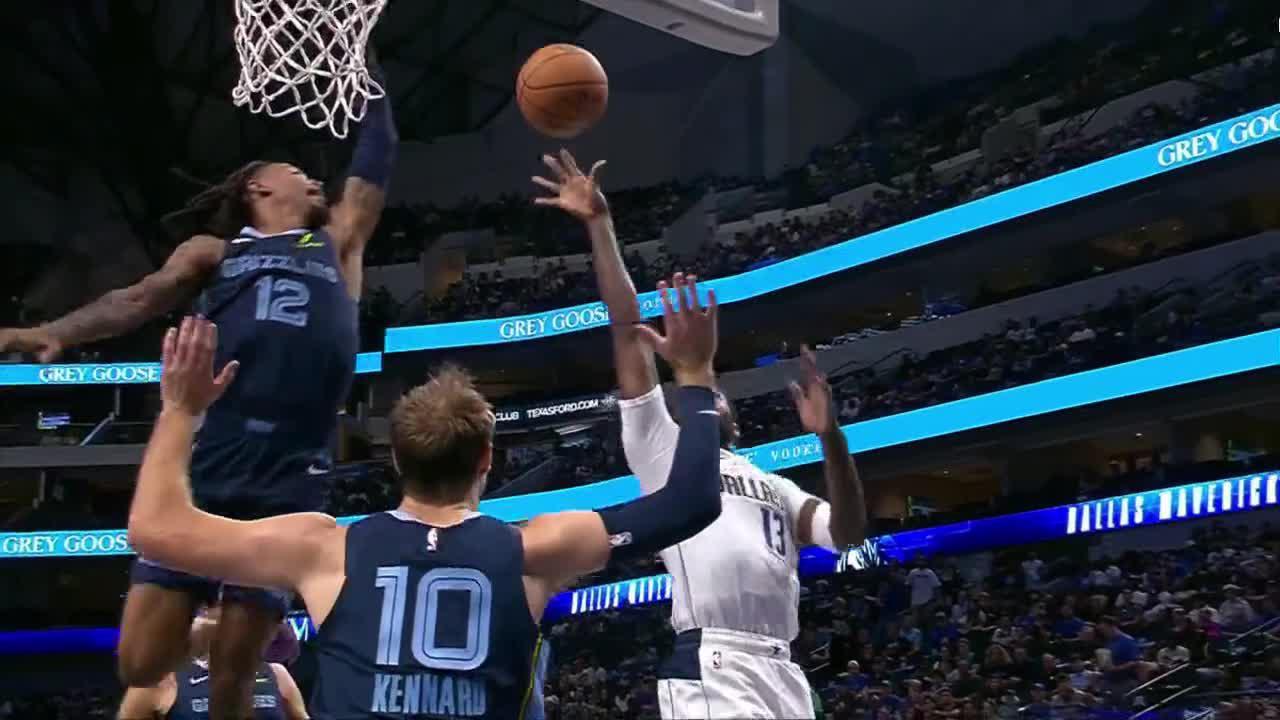 Ja Morant jumps out of the gym to block this shot