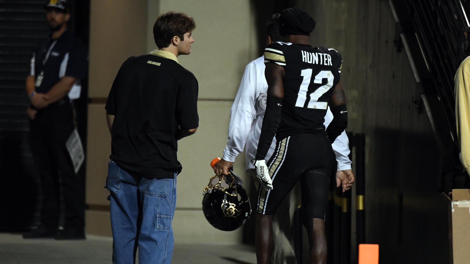 Travis Hunter exits to locker room with an injury