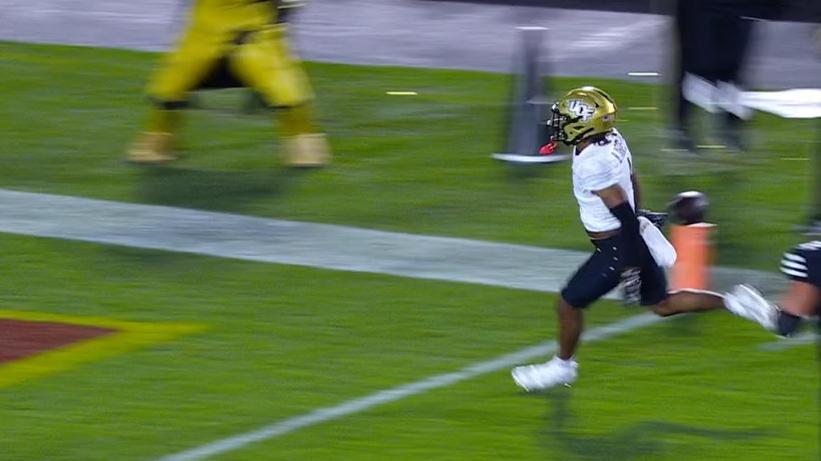 UCF player drops the ball before he reaches the end zone