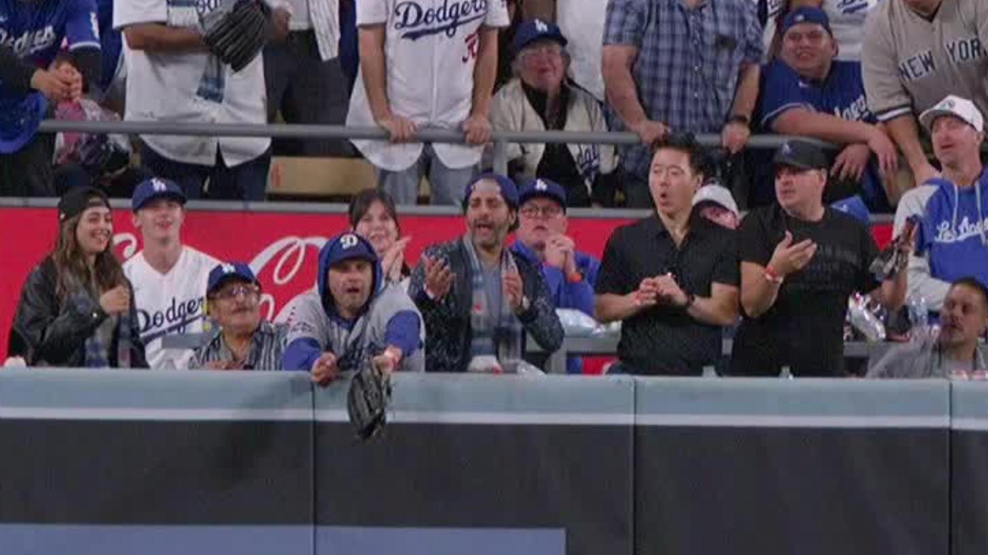 Umps rule interference as Dodgers fan questionably aids Yankees