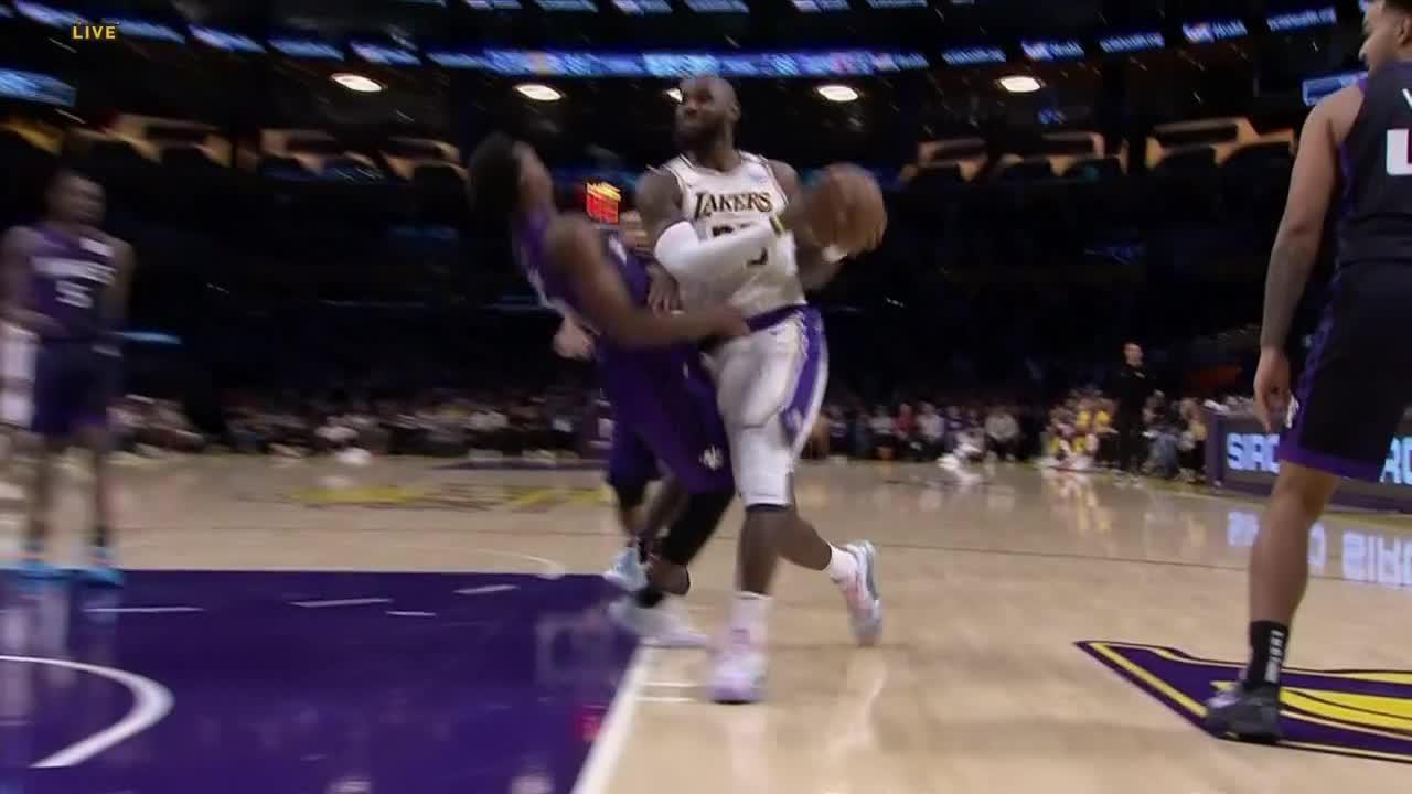 LeBron plows through Malik Monk for Lakers and-1