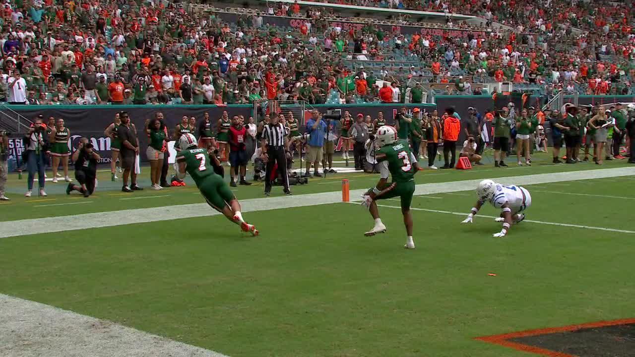 Miami's Xavier Restrepo hauls in a touchdown off a tipped pass