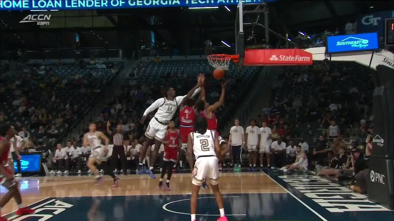 Javian Mccollum fights off defender for and-1