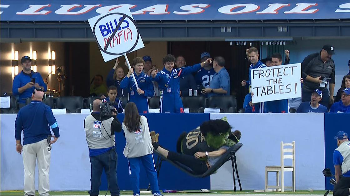 Colts mascot takes flight WWE-style to put someone through a table