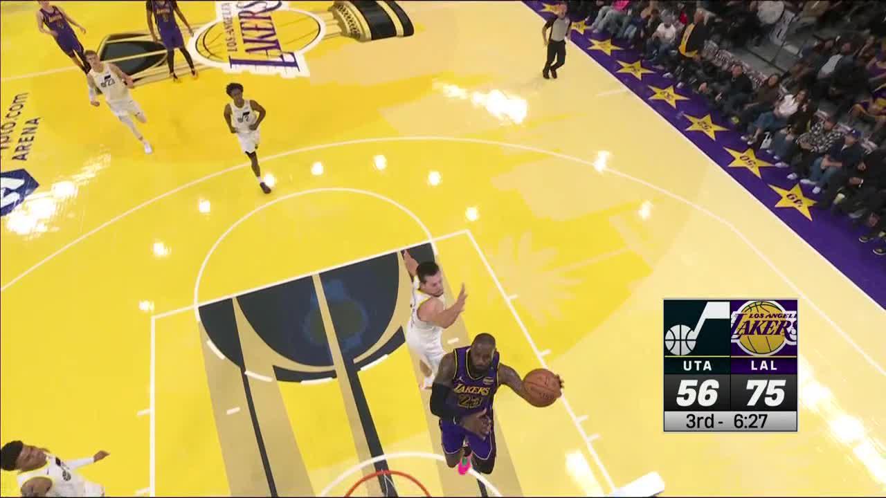 LeBron double-clutches for a big lefty jam