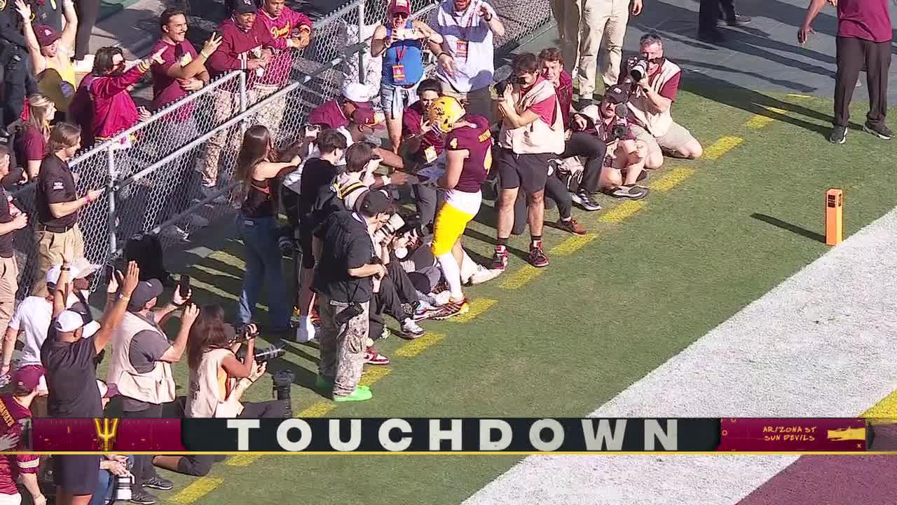 Cam Skattebo celebrates 3rd TD by autographing football