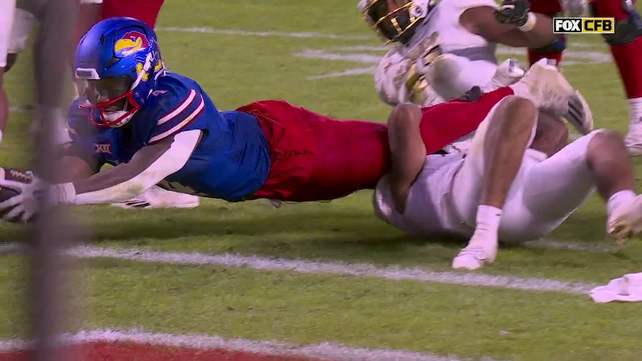 Devin Neal runs in his 3rd TD of the game for Kansas