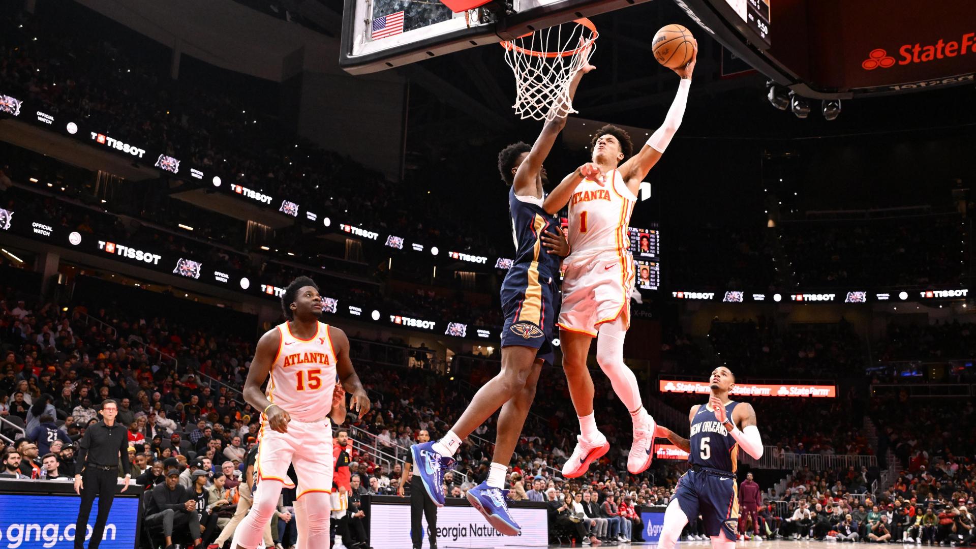 Jalen Johnson switches hands midair on this dunk
