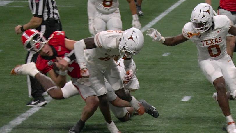 Texas' Andrew Mukuba lays the boom on punishing hit in OT