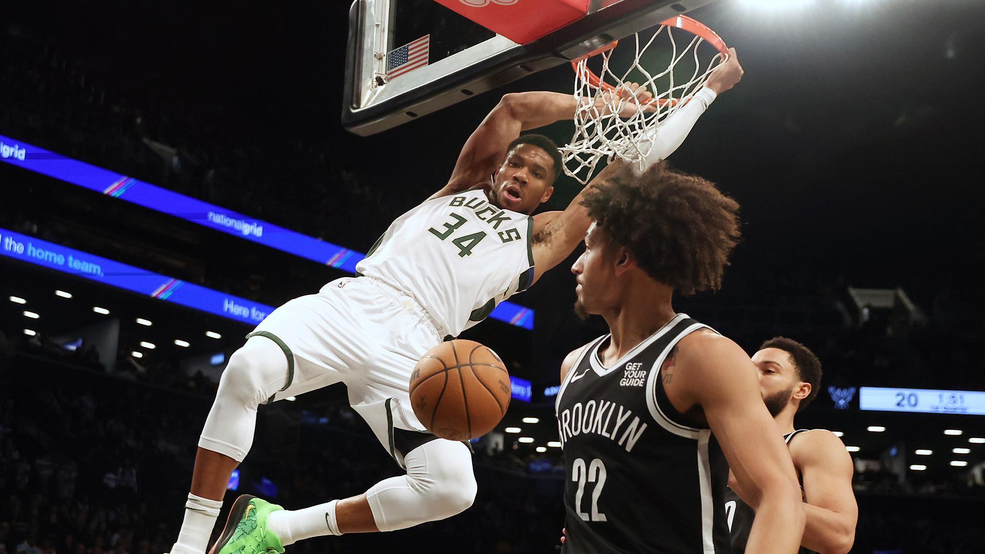 Giannis bullies his way to the rim for dunk