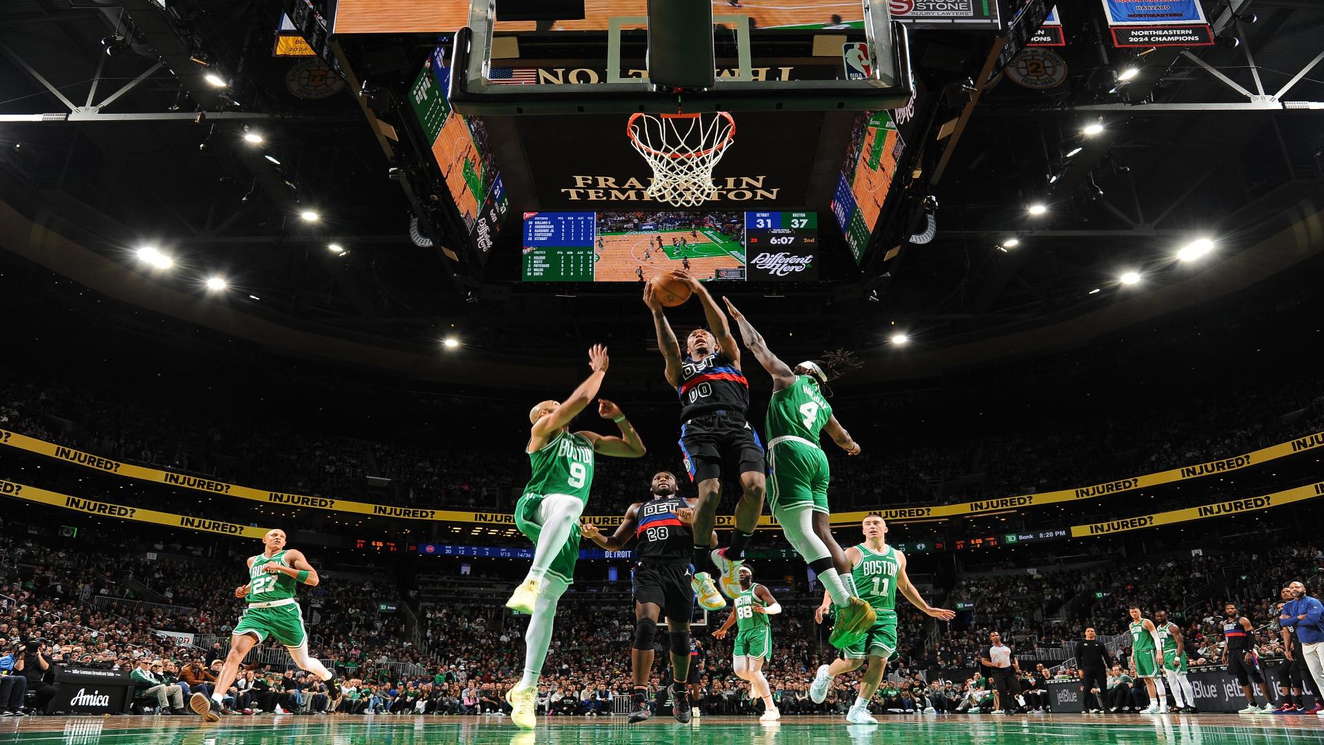 Ron Holland II with the acrobatic move midair for the basket