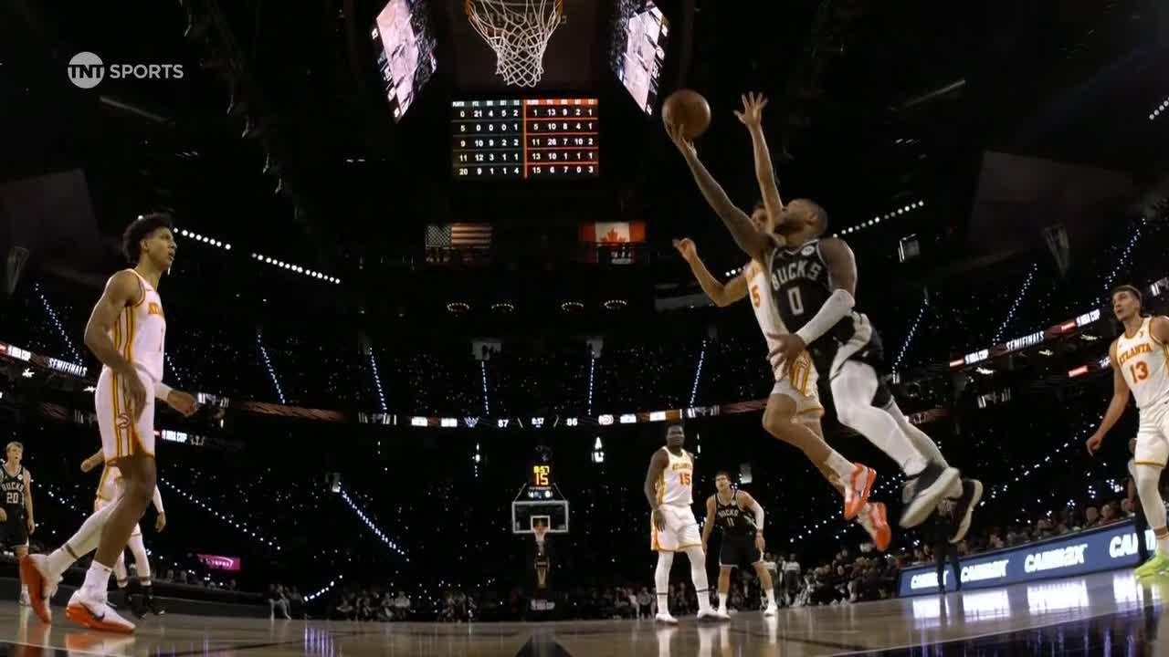 Dame splits two defenders for the crafty layup