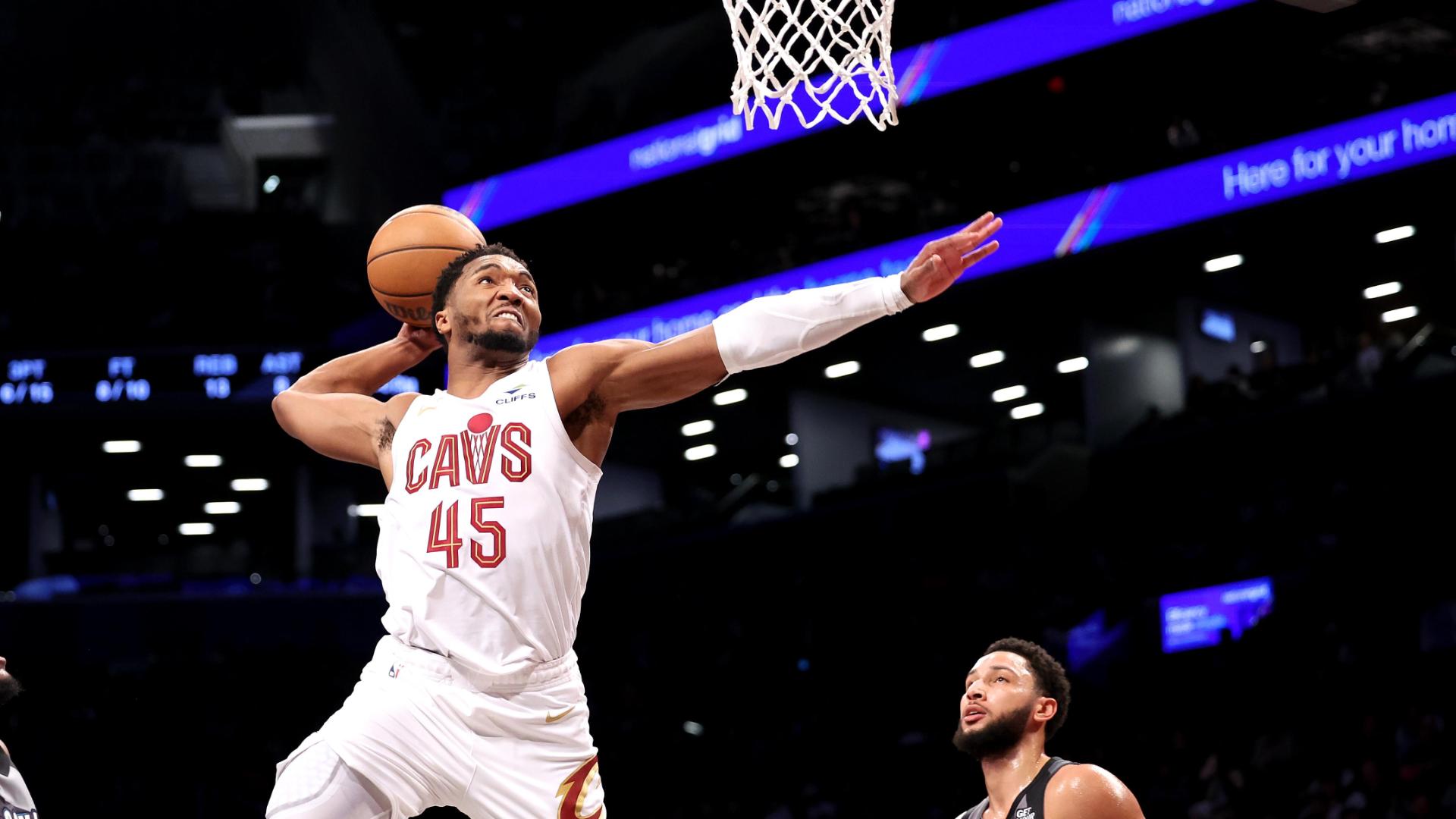 Donovan Mitchell reaches way back on this one-hand slam