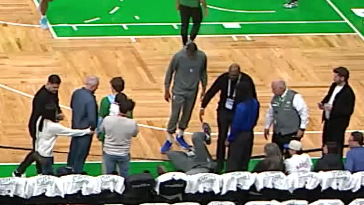 Joel Embiid takes a tumble during pregame warmups