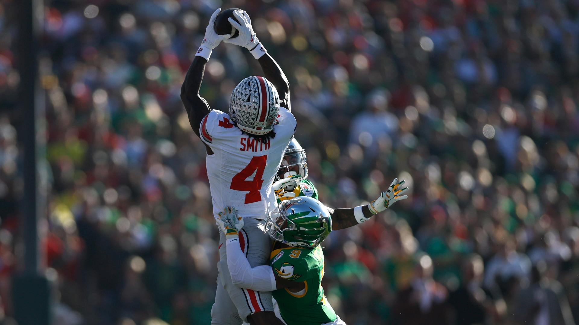 Jeremiah Smith leaps over three Oregon defenders for impressive grab