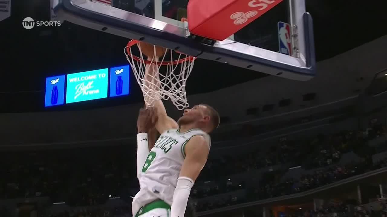 Kristaps Porzingis rises up for a putback slam