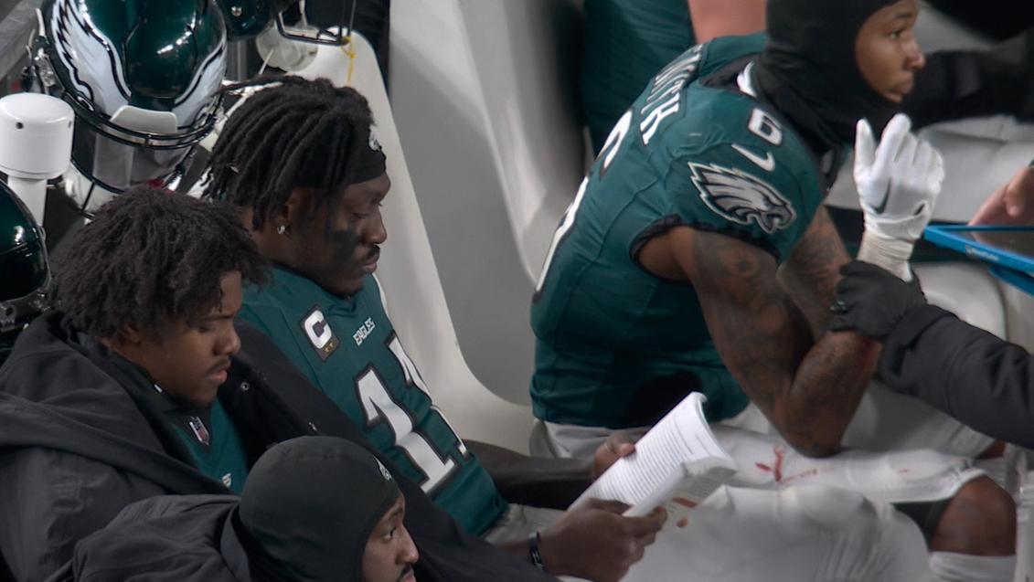 A.J. Brown reads a book in between drives