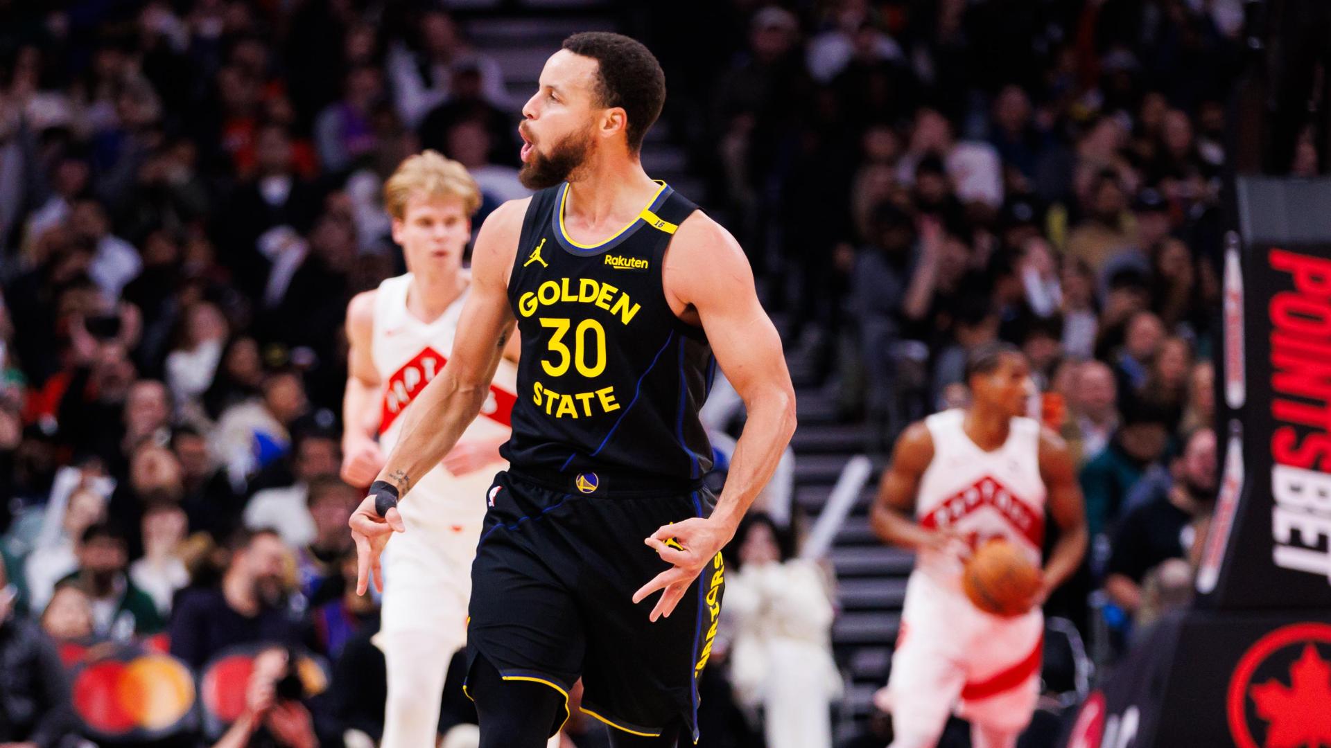 Curry knocks down a 3 from the Raptors' logo