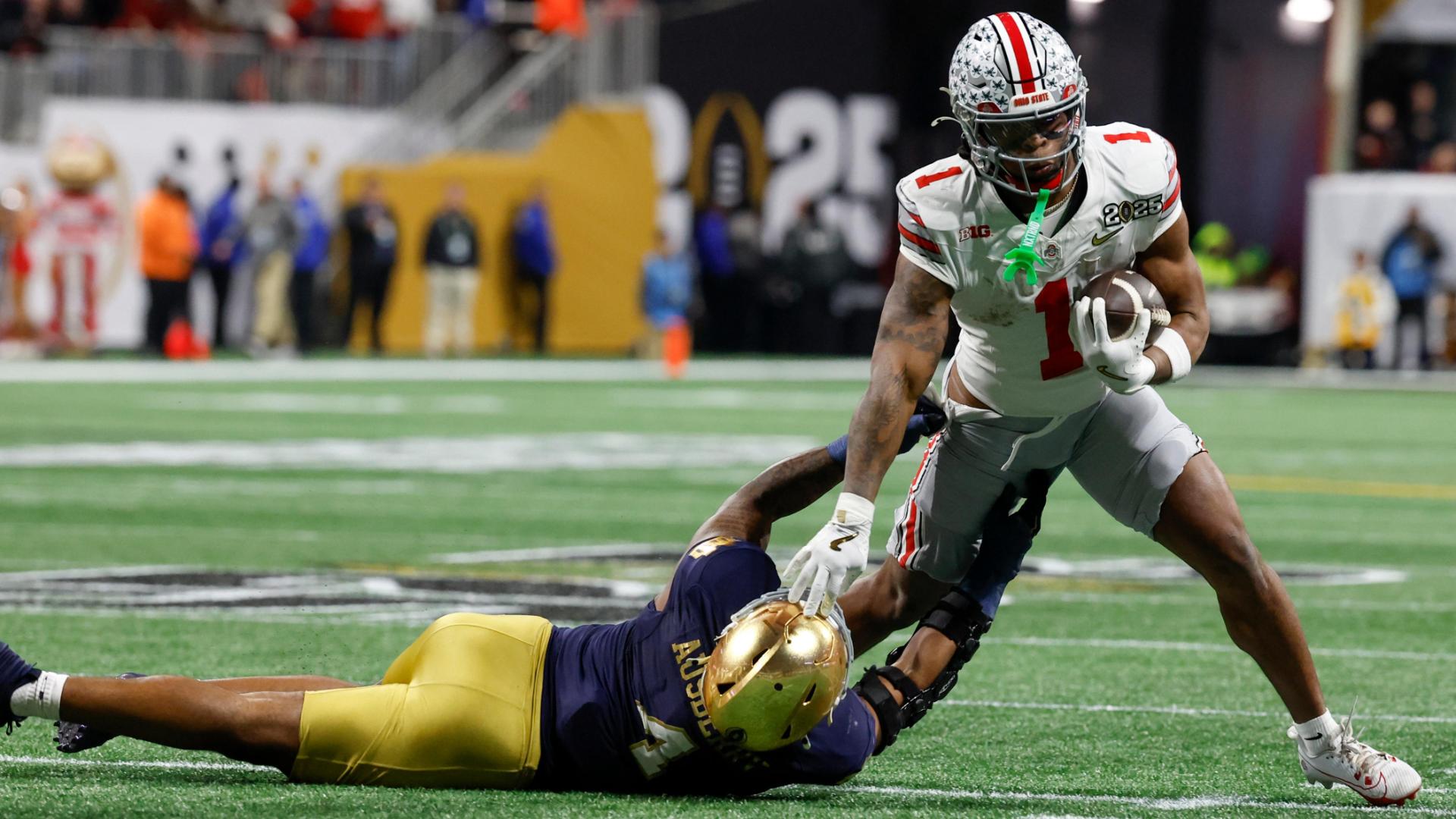 Quinshon Judkins stiff-arms his way for an OSU TD