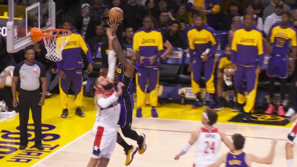 LeBron James puts Jonas Valanciunas on a poster