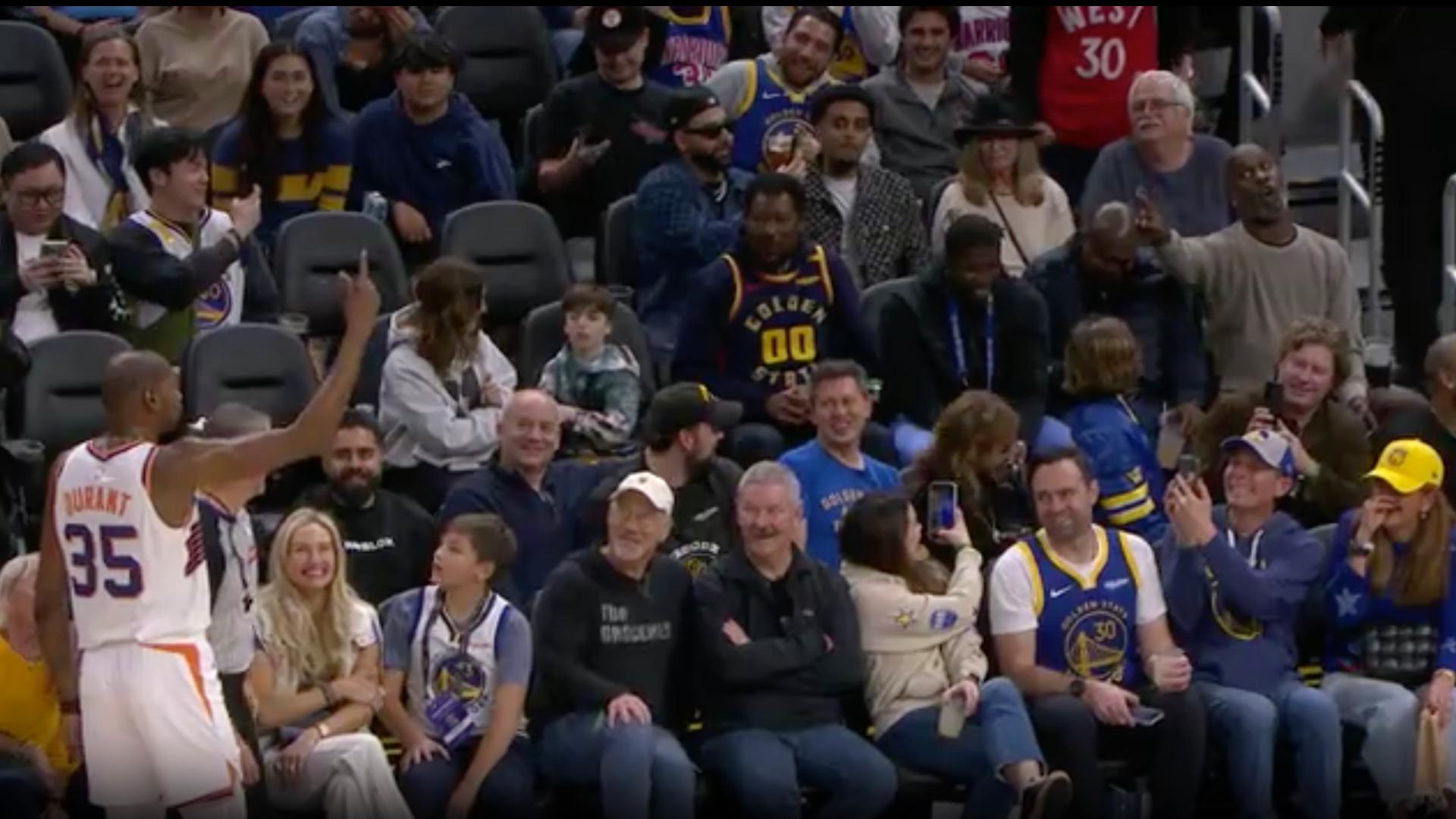 Kevin Durant and Gary Payton have some fun during a timeout