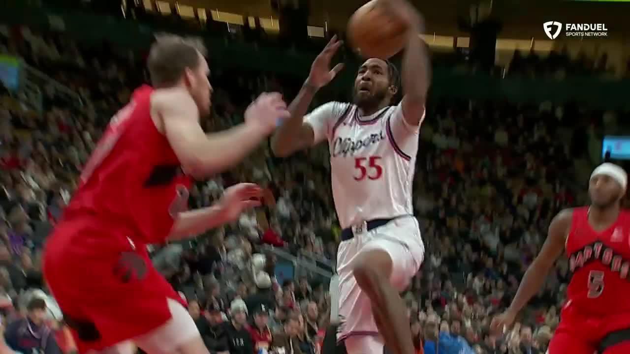 Derrick Jones Jr. maneuvers past multiple defenders for a 1-handed jam